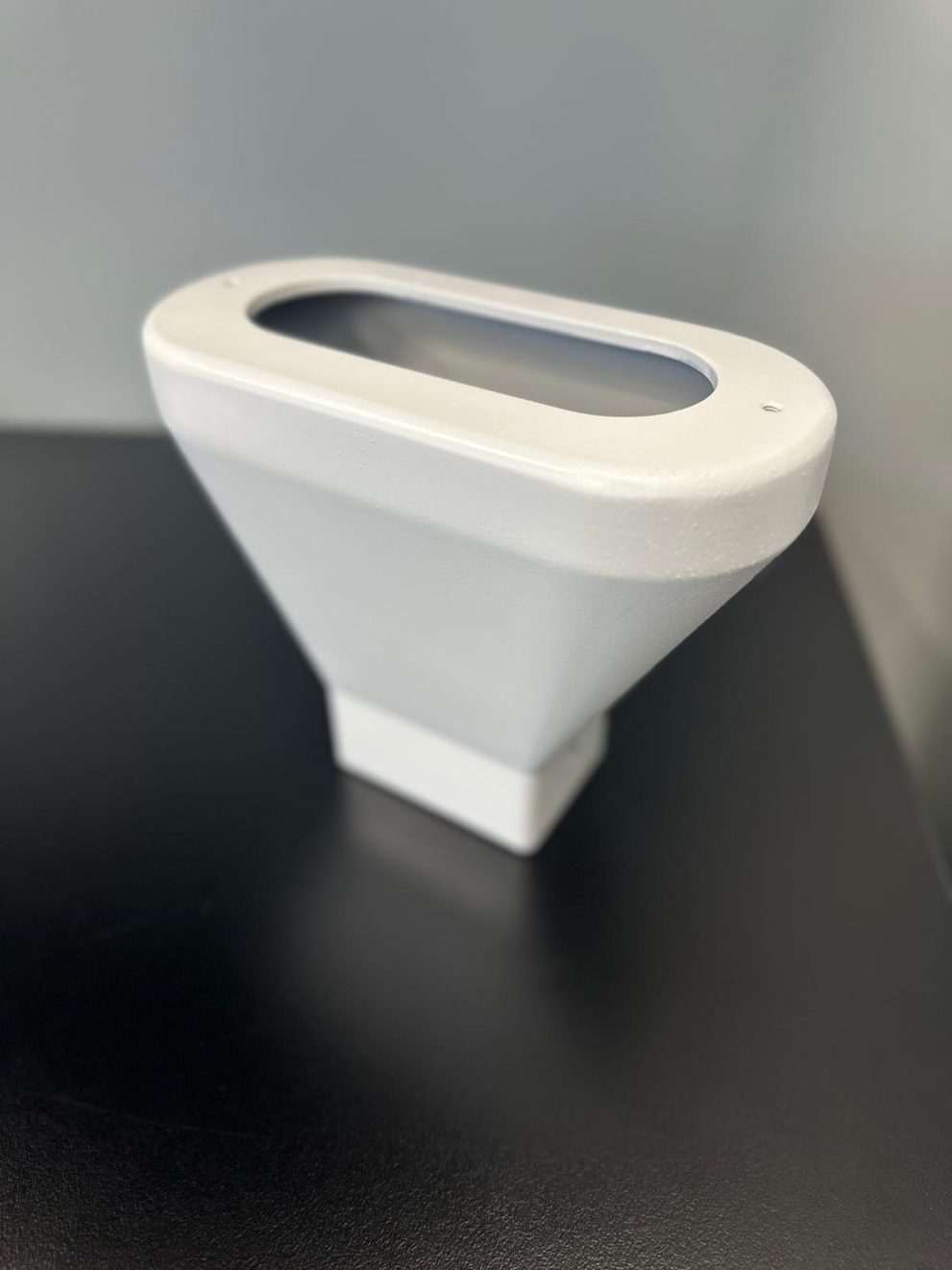 3D-printed light housing with painted white cosmetic finish1